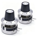 Pair of rotary linear potentiometers with black ridged knobs and silver mounting pins