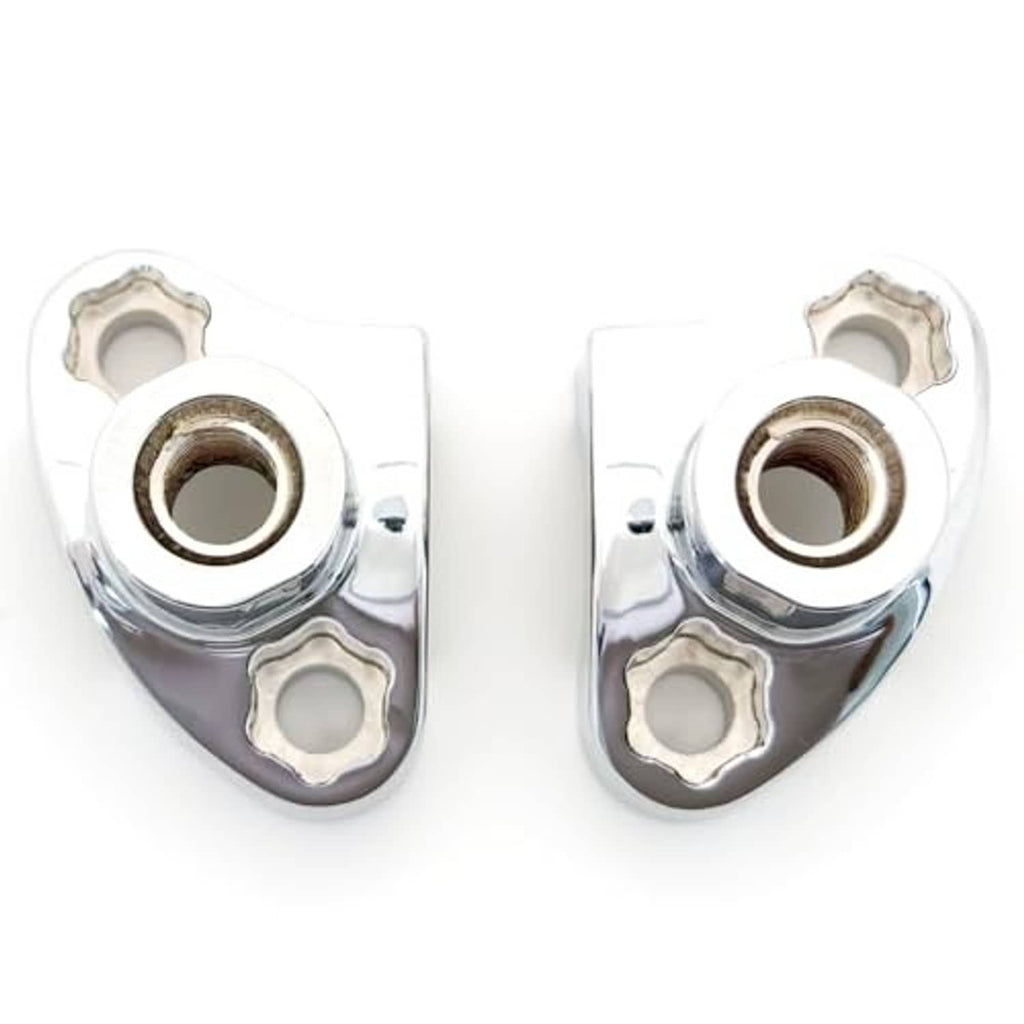 Chrome underside view of handlebar risers with central threaded bores and bolt holes