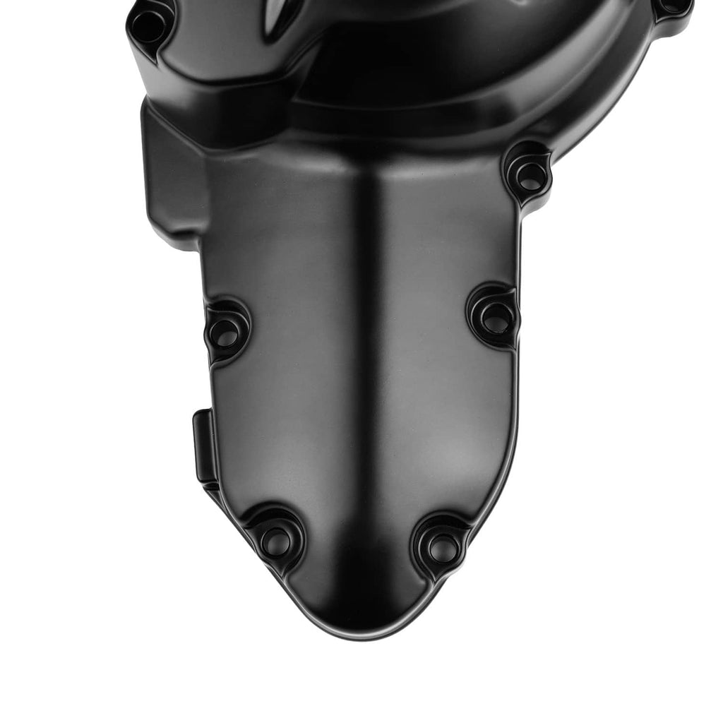 Black engine crank case cover close-up with mounting bolts.