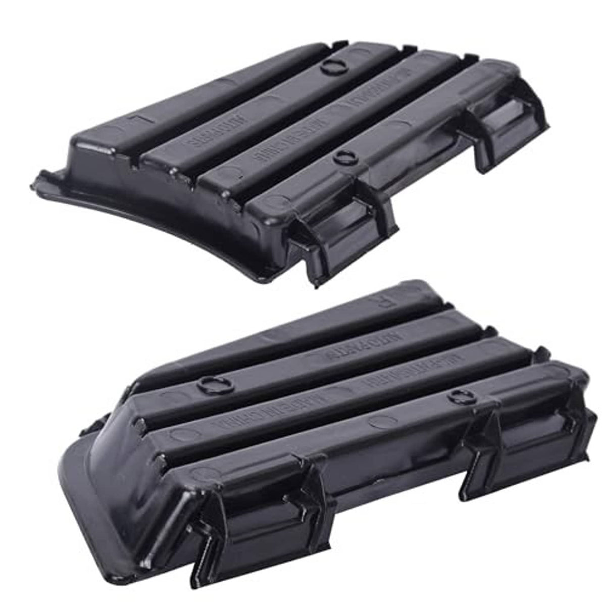 Black fog light grille covers with raised slats and central clip mounts, curved housing