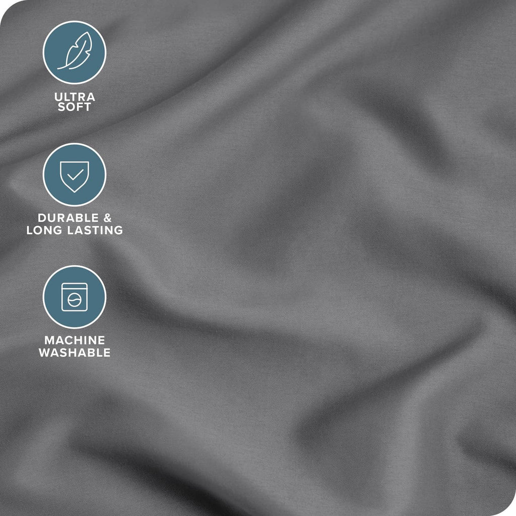 Grey microfiber pillowcase fabric close-up, smooth drape with soft sheen.