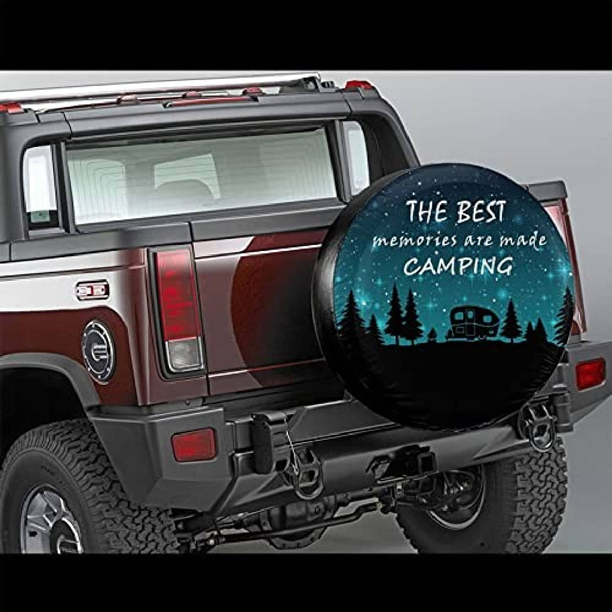 Spare tire cover with teal camping graphic mounted on the rear of an SUV