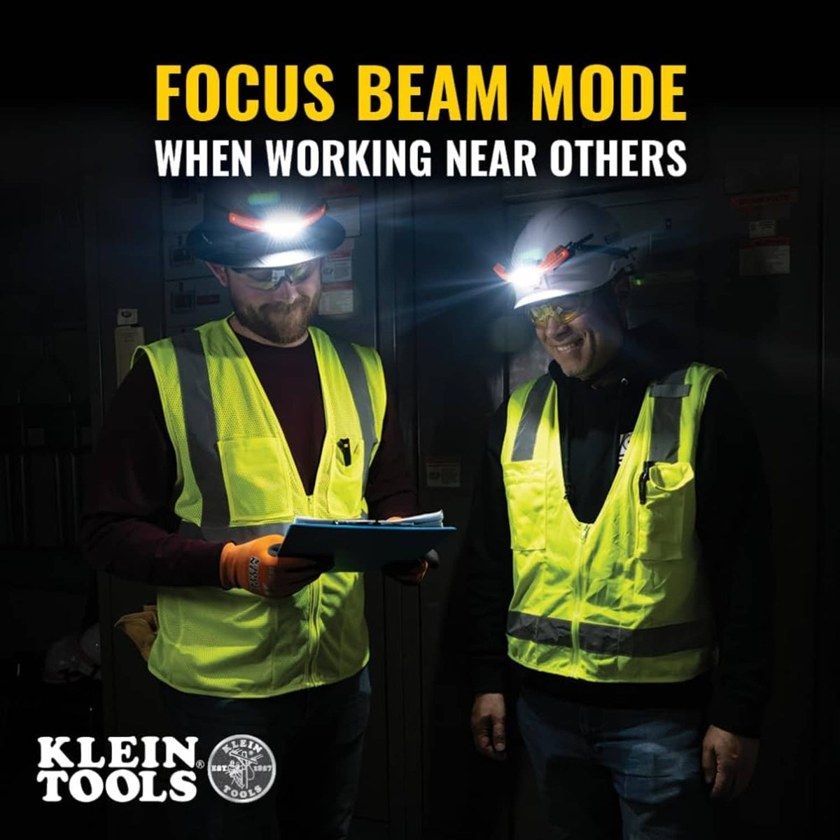 Two workers wearing rechargeable LED headlamps with bright white beam