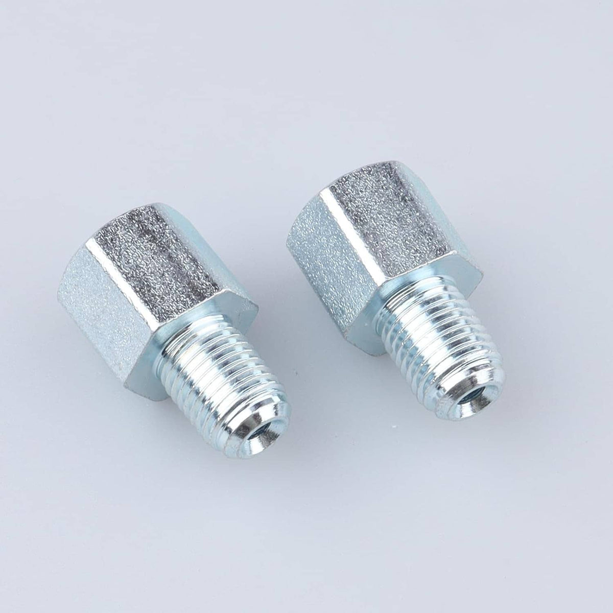 Brake line thread adapter pair with silver hex ends and detailed threaded sections