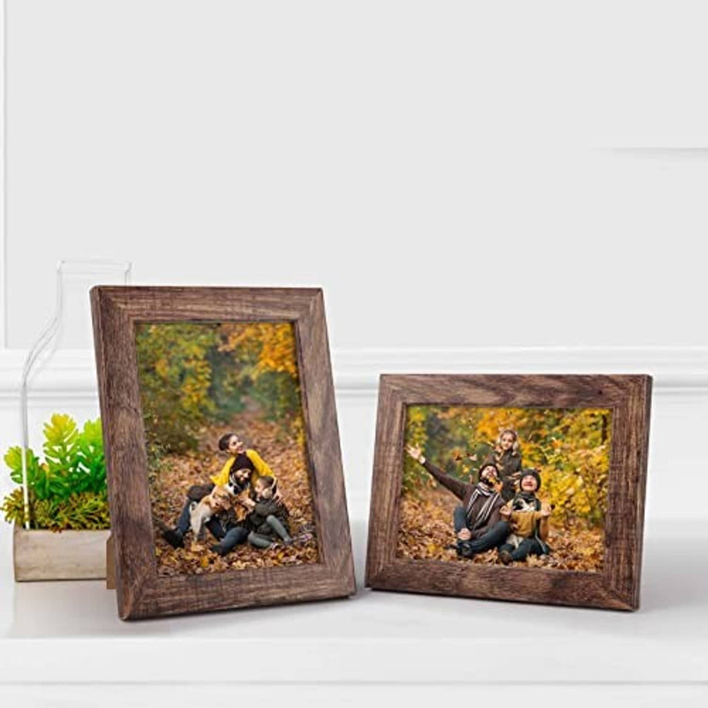 Two rustic brown picture frames with landscape photo cards and easel-style display stands