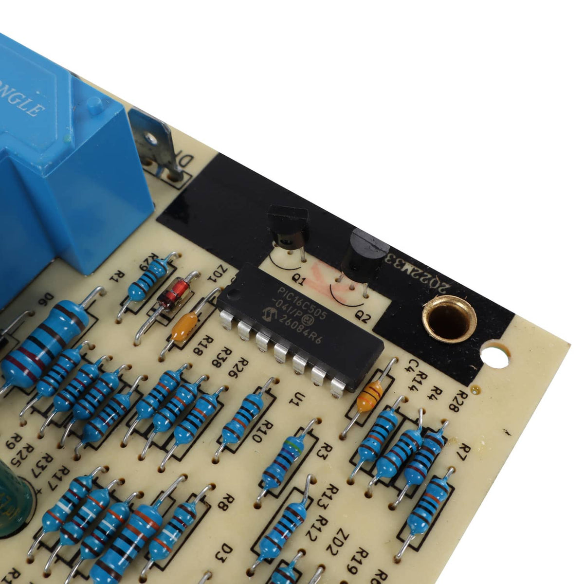 Control circuit board close-up with blue relay, ICs, and solder points