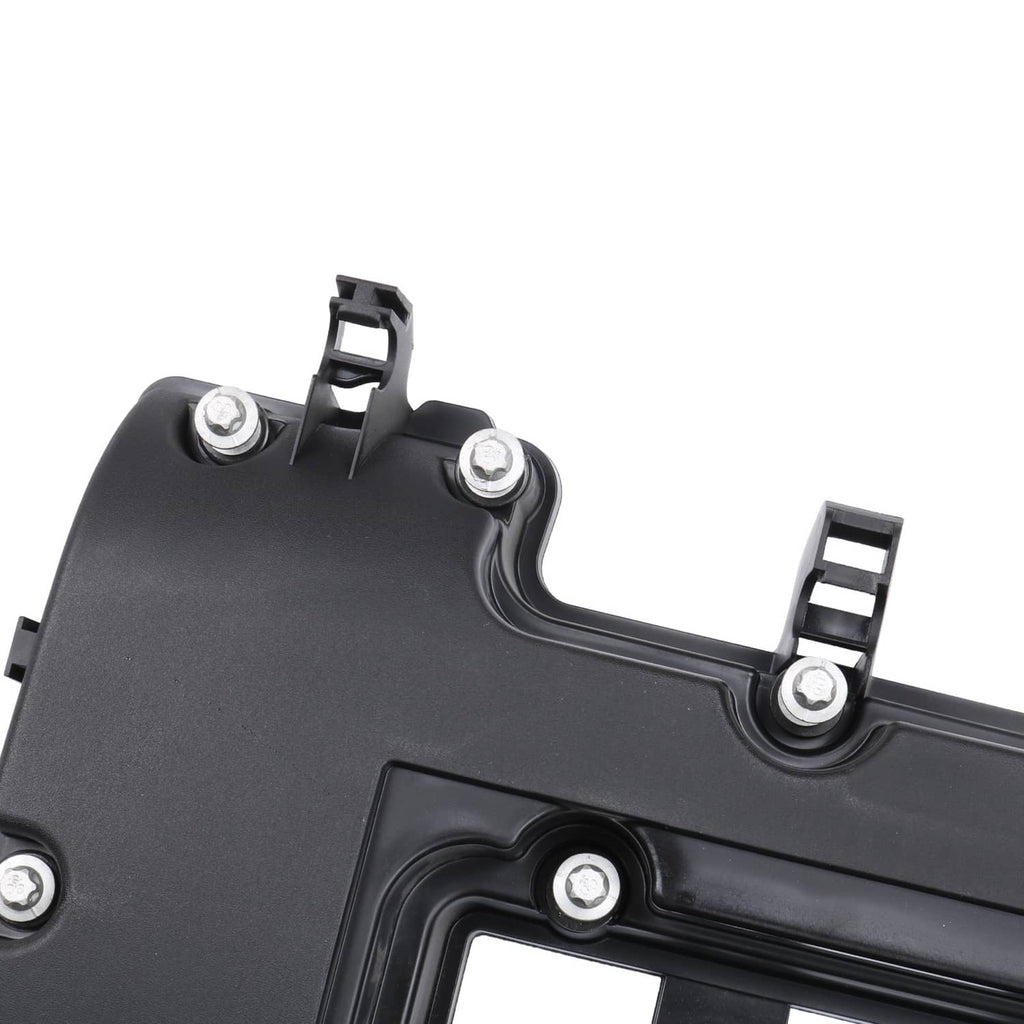 Black valve cover close-up showing gasket groove and threaded mounting posts