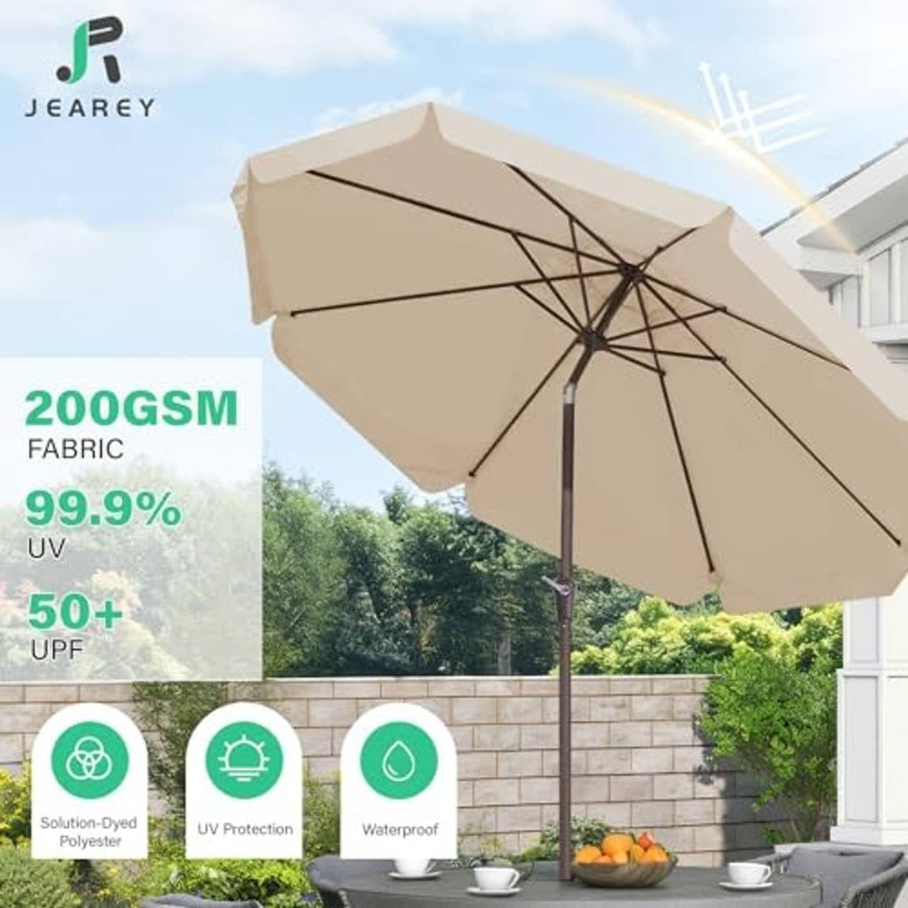 Beige patio market umbrella with open canopy and tilted frame over outdoor seating