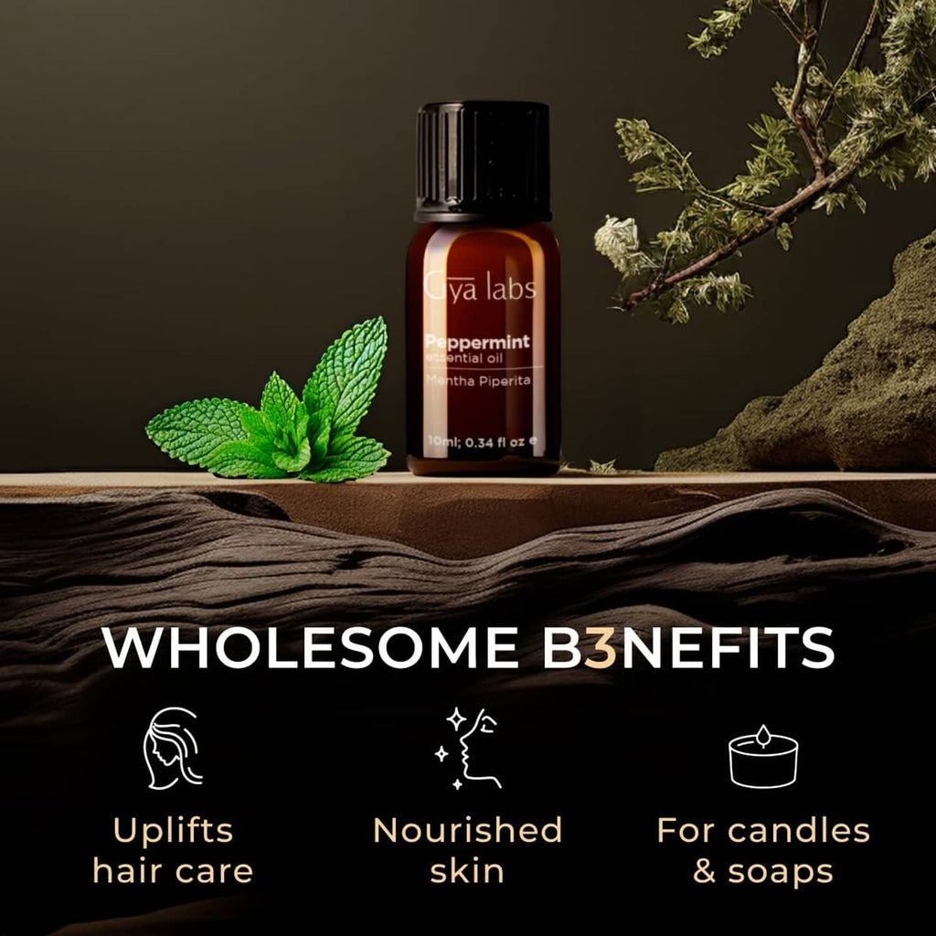 Peppermint essential oil bottle with green peppermint leaves on tabletop