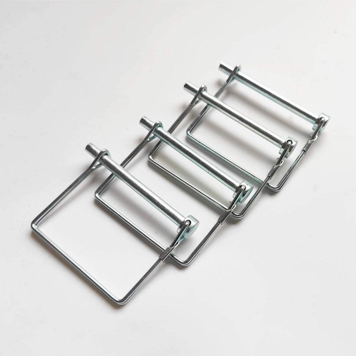 Set of metal wire lock pins with locking clips and loop handles for couplers