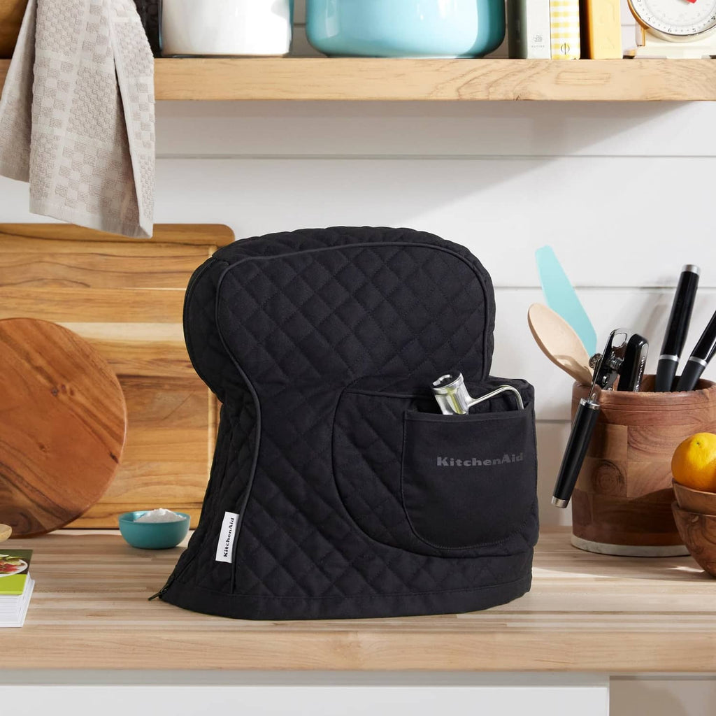 Matte black quilted stand mixer cover with front pocket and side opening