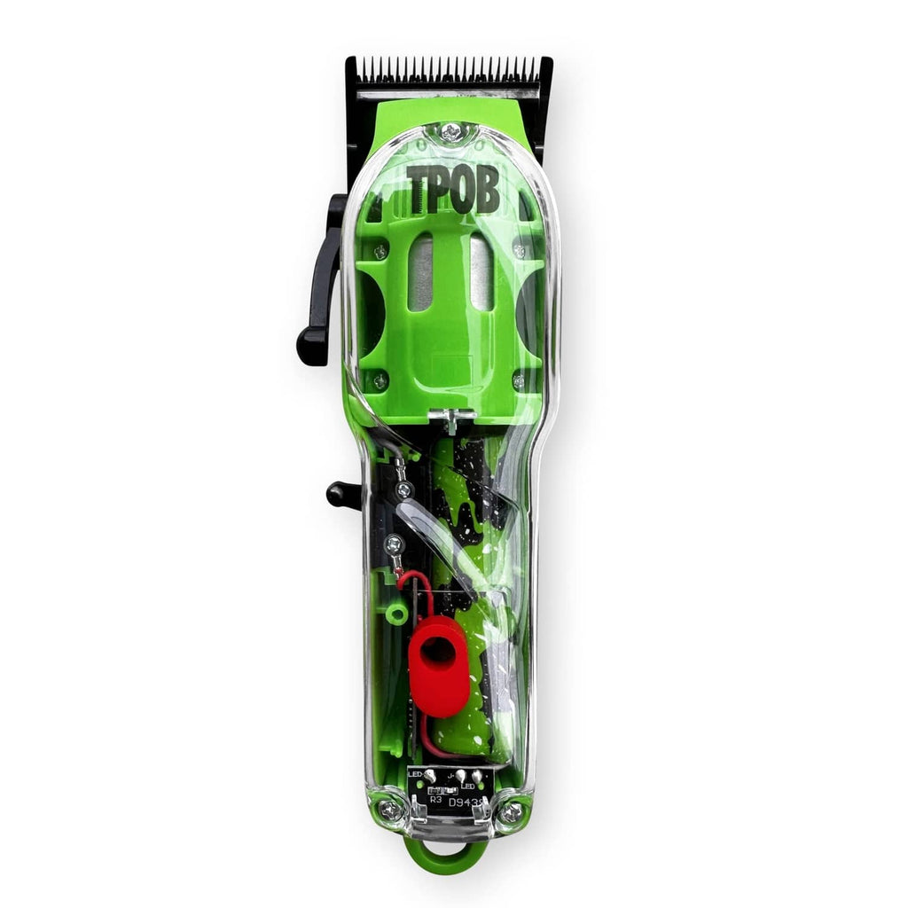 Clear-cased green hair clipper with black blade, red lever, and side grip