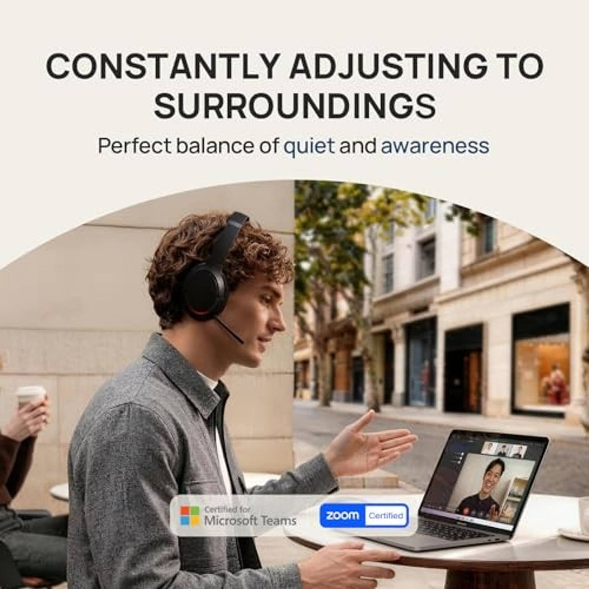 Over-ear noise-cancelling headset worn at a desk, boom mic and padded ear cups.