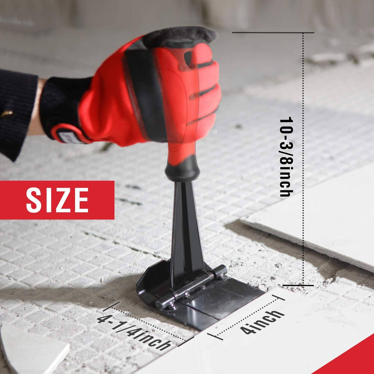 Trim puller tool with black base standing on floor edge and red handle