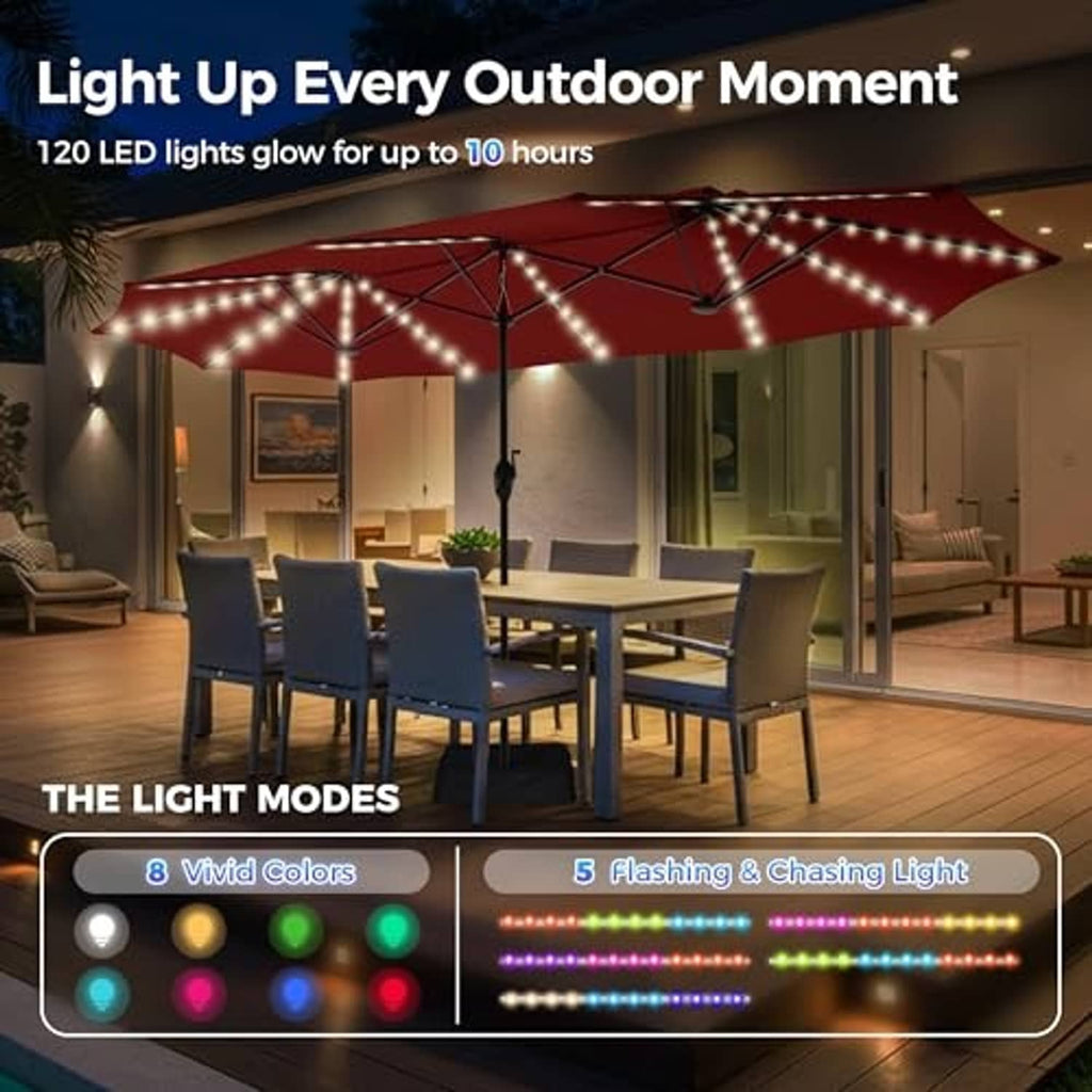 Burgundy patio umbrella lit with LED string lights over an outdoor dining area.
