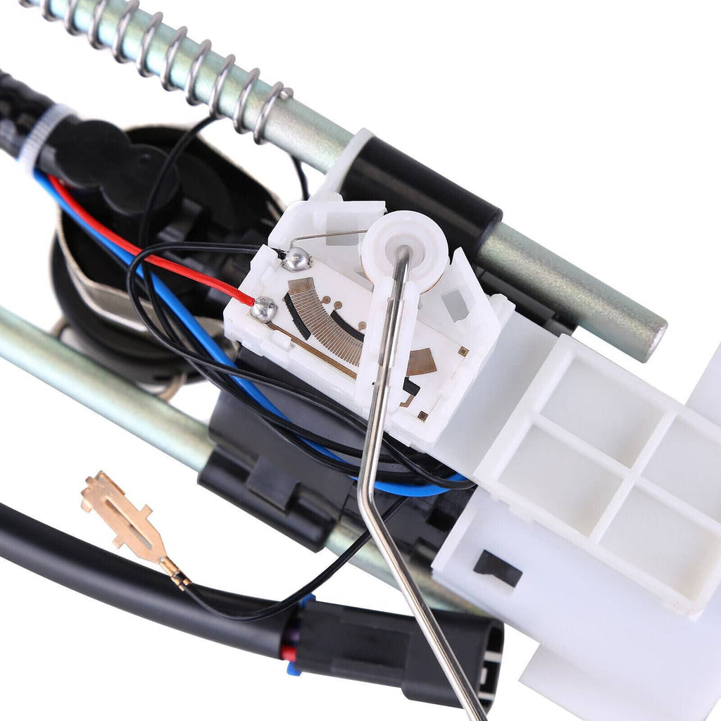 Fuel pump assembly interior with white connector block and black wiring harness
