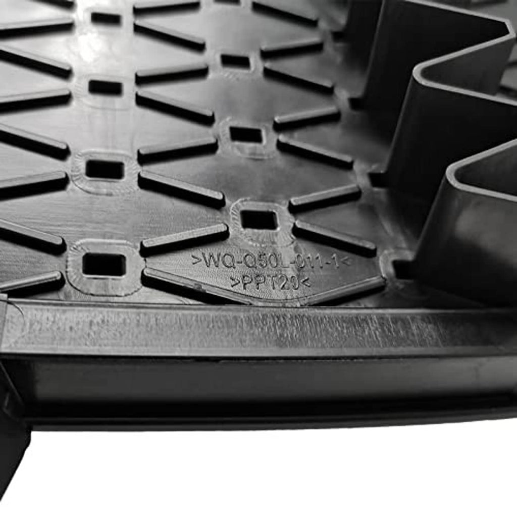 Front bumper grille cover close-up, black plastic mesh with molded markings