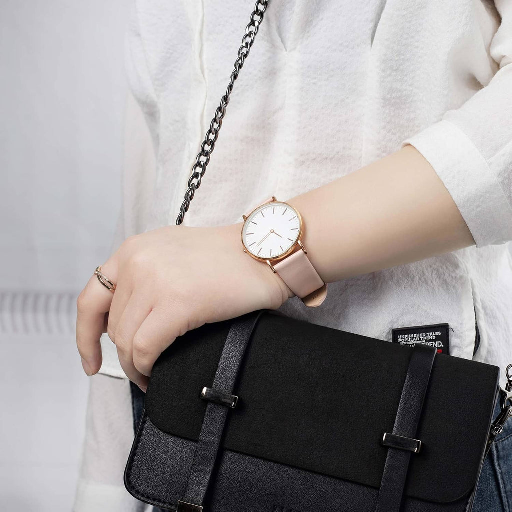 Woman’s wrist wearing a pink 12mm leather watch band with rose-gold buckle