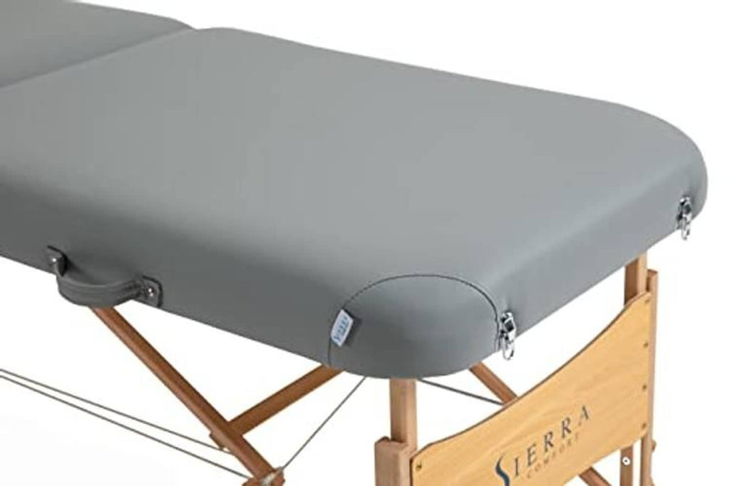 Gray padded massage table armrest detail on wooden frame