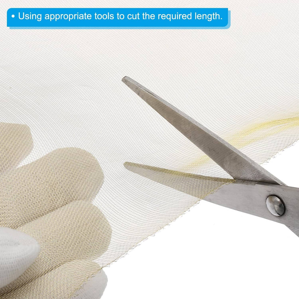 Brass woven wire mesh roll, trimmed cut edge shown with metal scissors