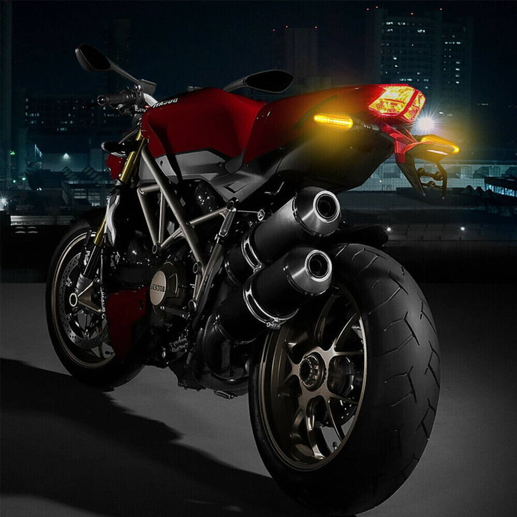 Motorcycle with two amber LED turn signal indicators and black housings in view