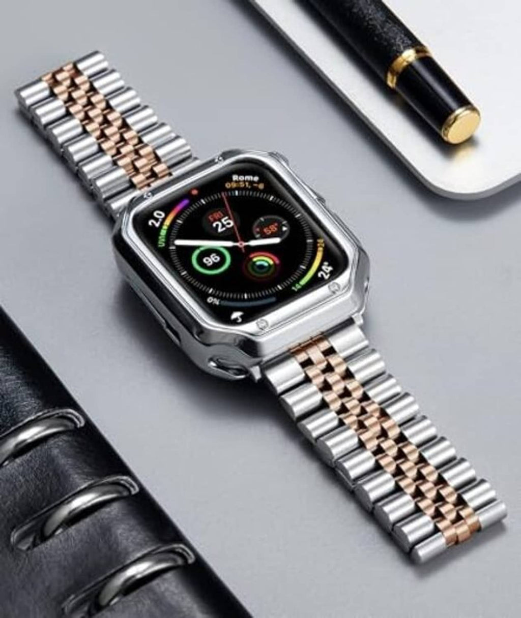Silver and rose-gold metal link watch band with Apple Watch on tabletop