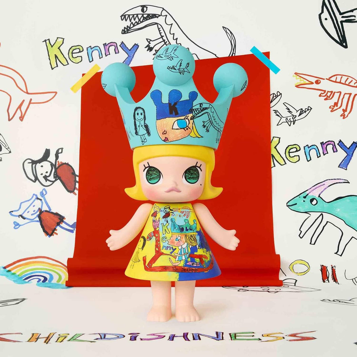 Royal Molly collectible doll front view, teal crown and yellow hair, colorful skirt