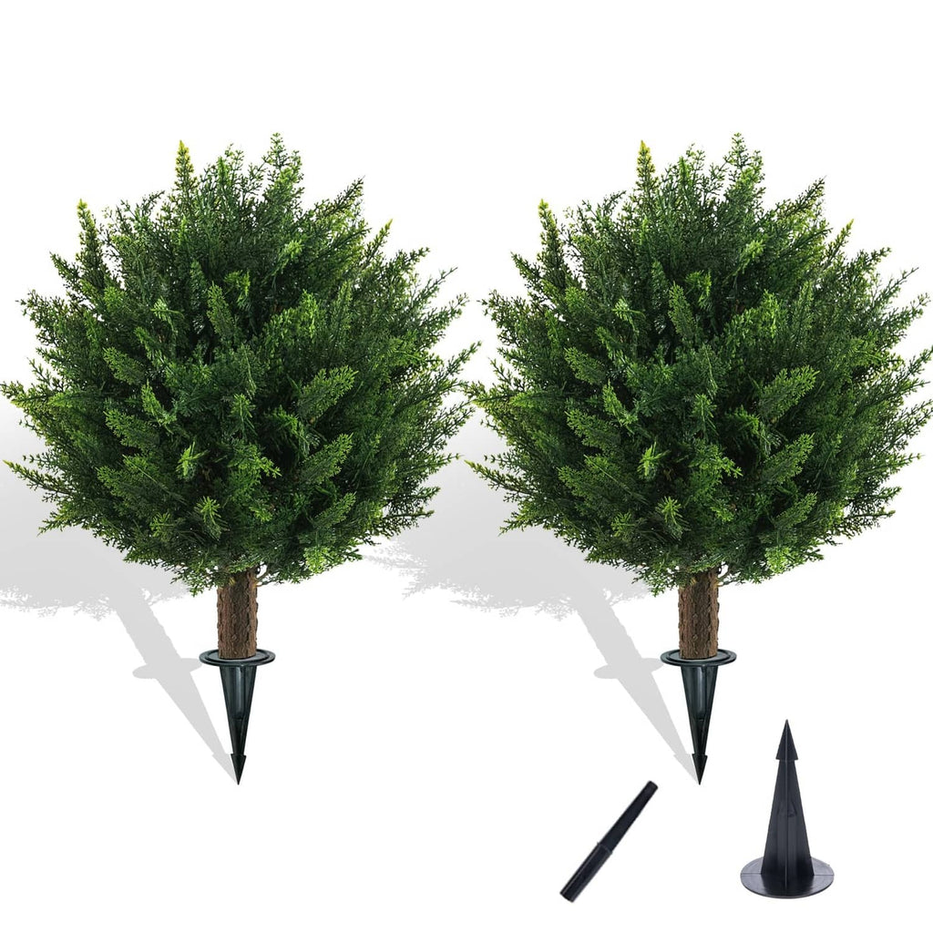 Two artificial cedar ball topiary trees with black spikes and stake parts