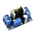 LM37 buck step-down regulator PCB with blue terminal blocks and heatsink