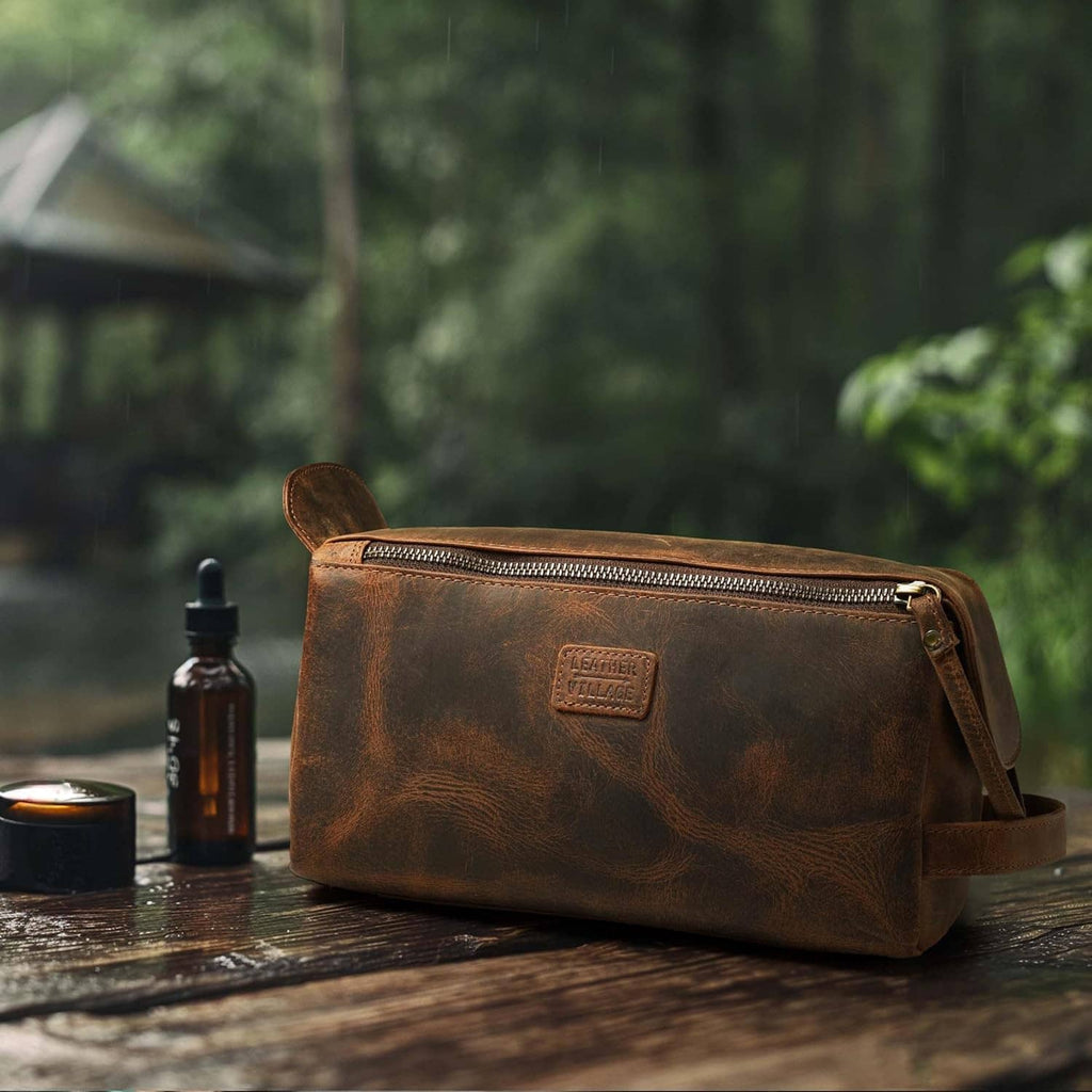 Brown leather toiletry bag with zip closure and embossed logo patch