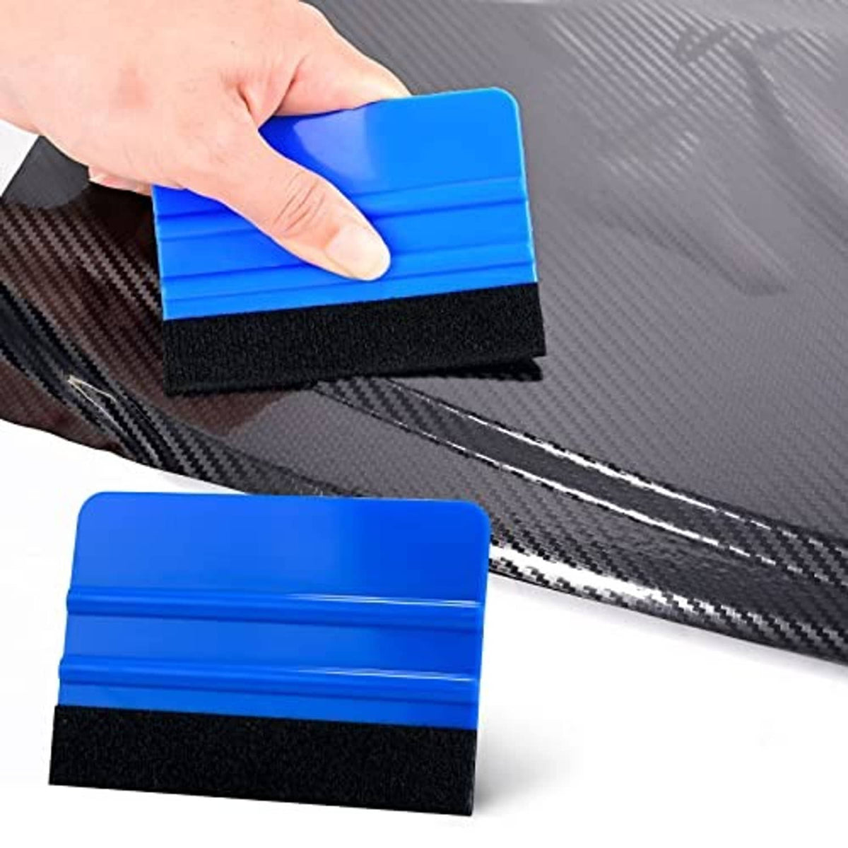 Blue felt squeegee pressing onto dark carbon-fiber style vinyl film