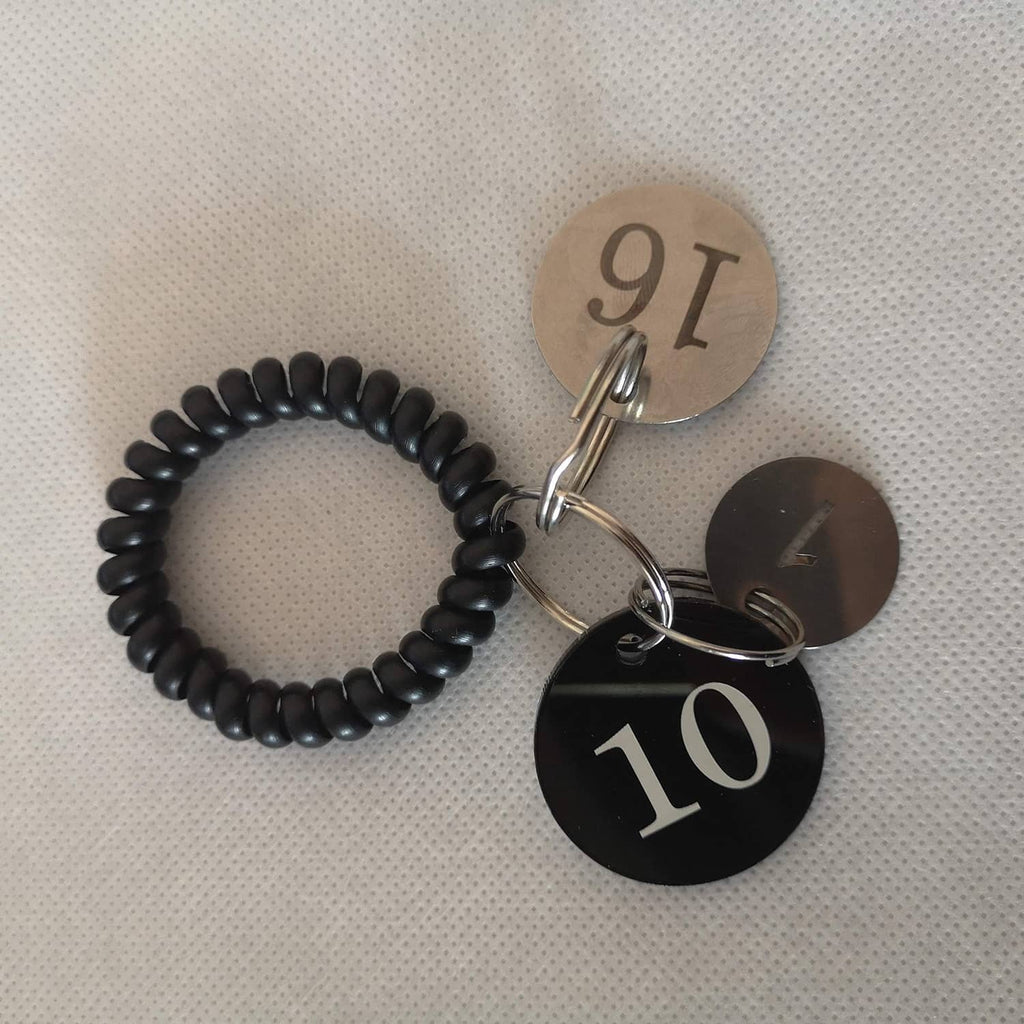 Stainless steel number key tags with rings, showing numbers 7, 9, and 10
