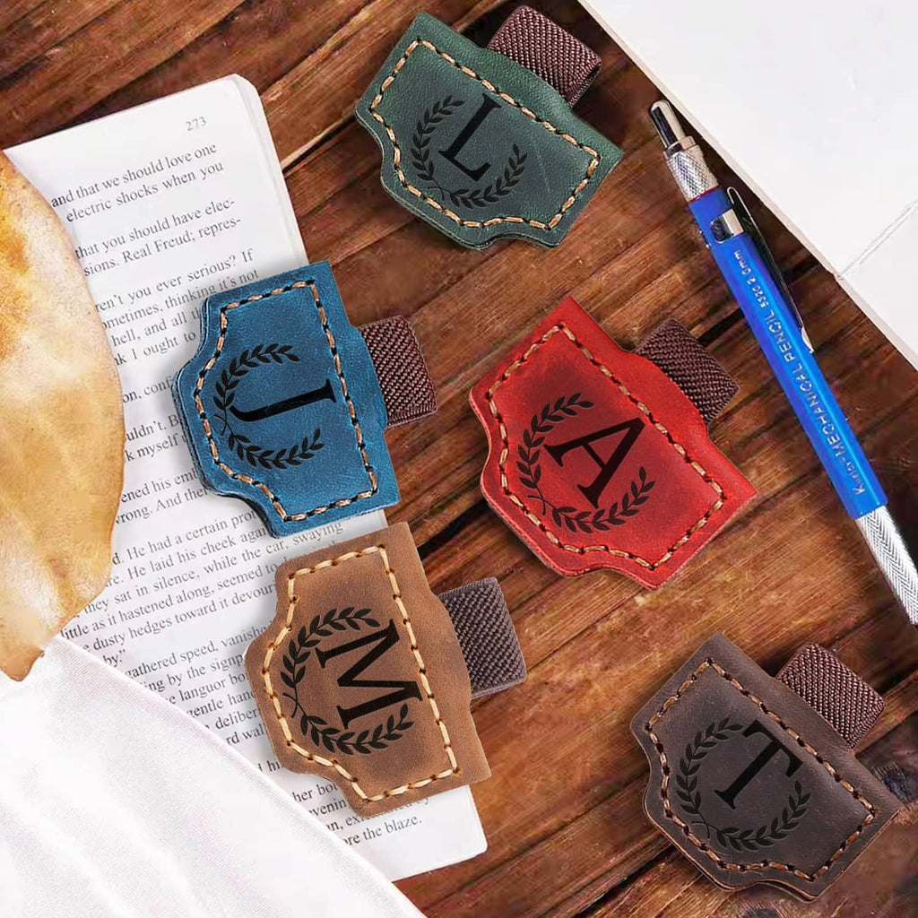 Leather magnetic letter bookmarks with stitched panels and laurel details, assorted colors