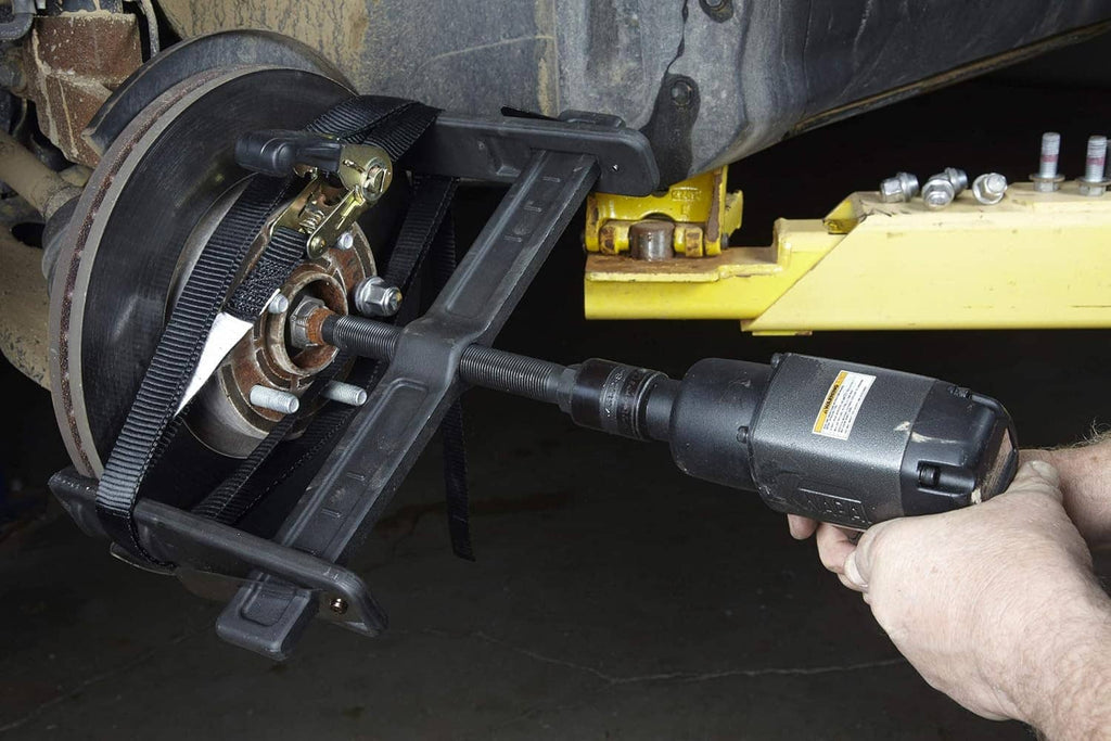 Brake rotor puller with cordless impact driver socket on threaded puller screw