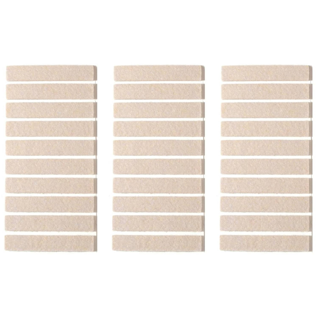 Beige rectangular adhesive felt furniture pads, arranged in multiple rows