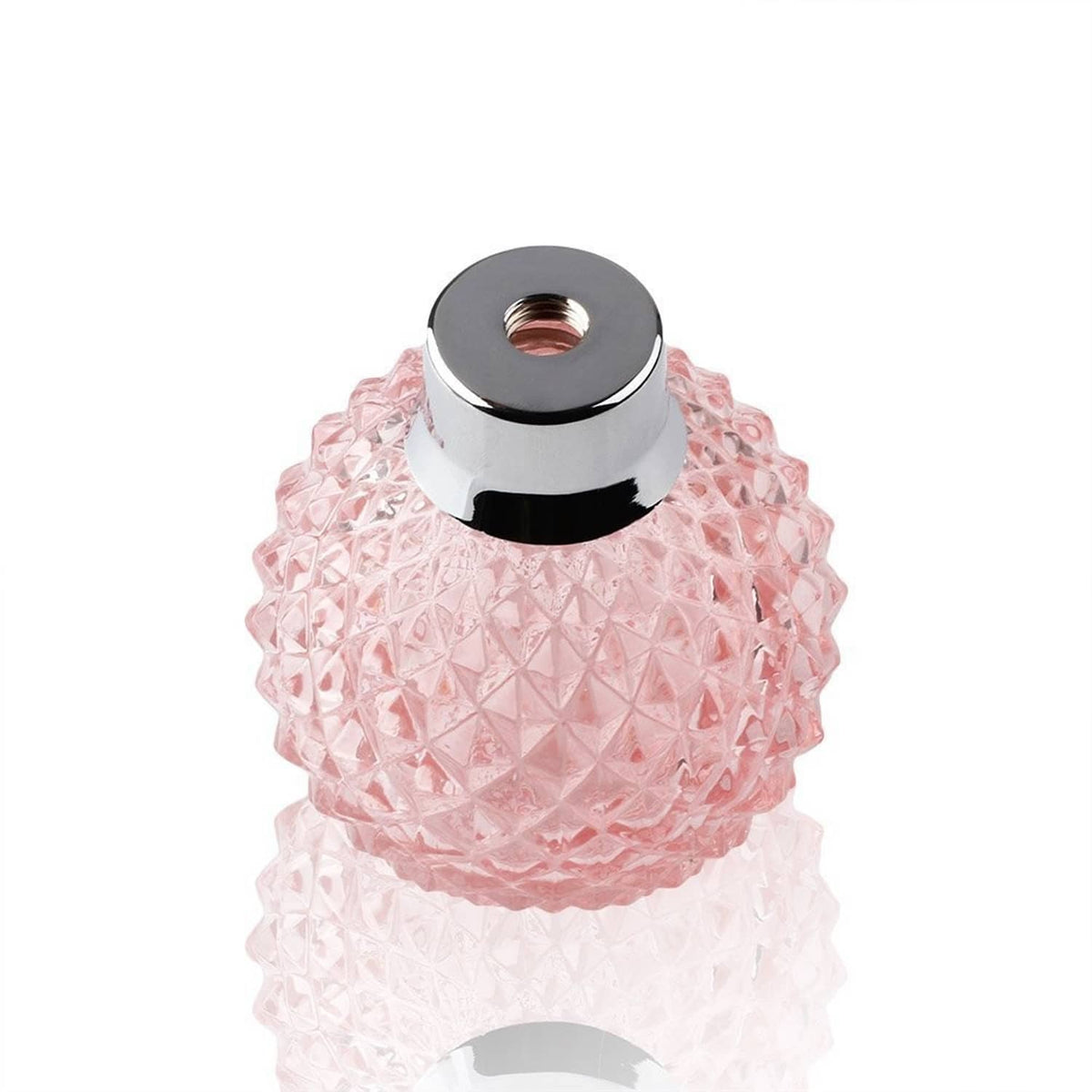 Refillable perfume atomizer with pink faceted glass bottle and round silver top cap