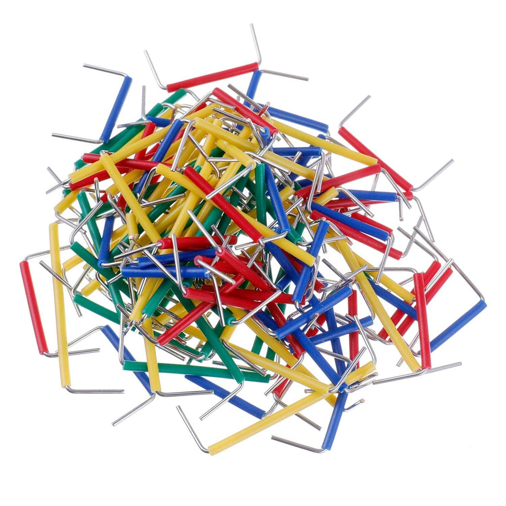 Pile of multicolor breadboard jumper wires with silver metal pins