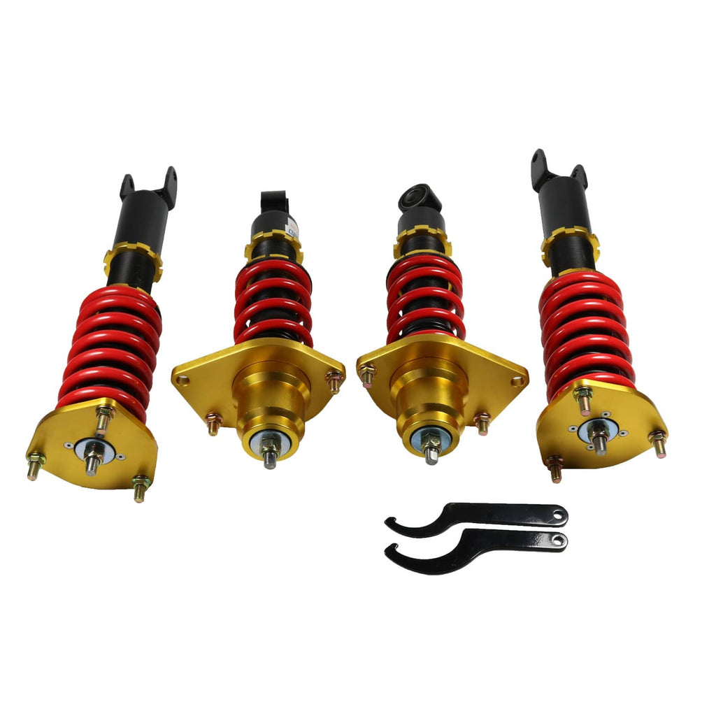 Coilover shock struts with red springs, black bodies, gold mounts, plus adjustment bracket set