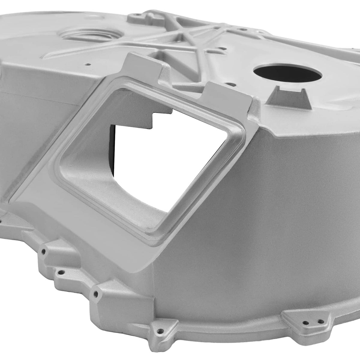 Close-up of aluminum inner clutch cover with rectangular opening and mounting brackets