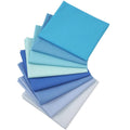 100% cotton solid blue fabric pieces, folded stack in multiple shades of blue