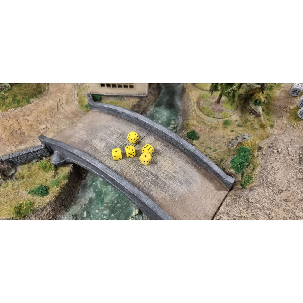 Yellow D6 dice with black spots scattered on tabletop terrain