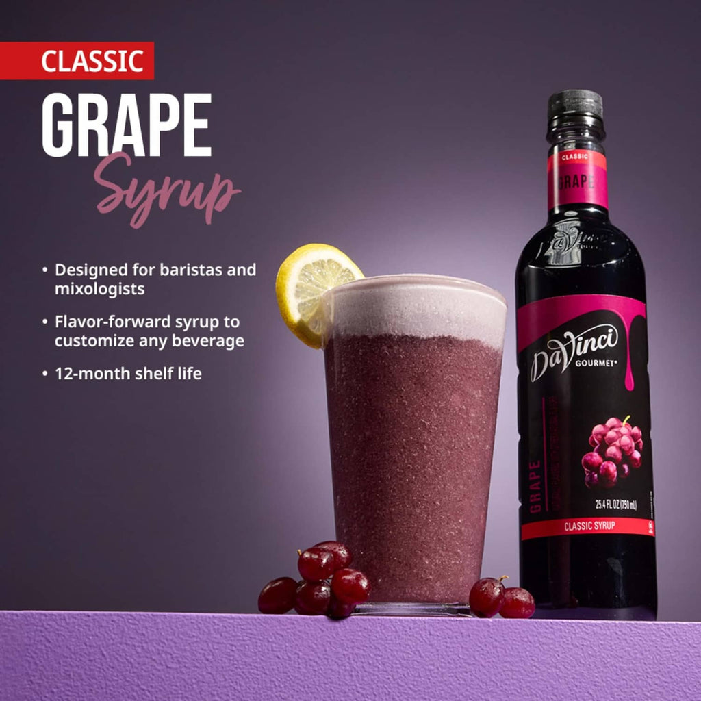 Classic grape syrup bottle with purple grape drink in a glass