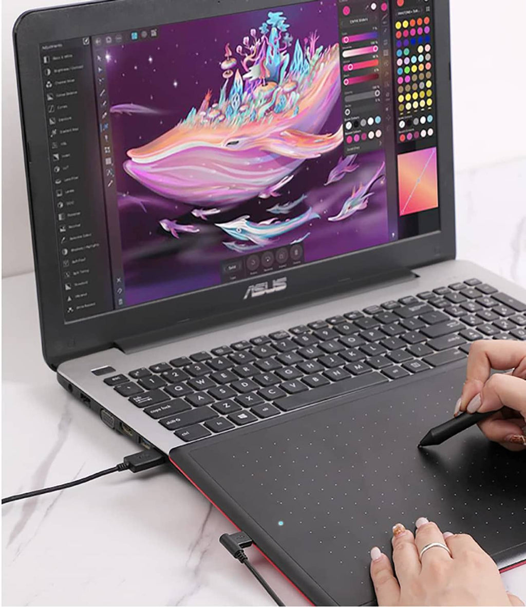 Micro USB cable plugged into a laptop for powering and connecting pen tablet.