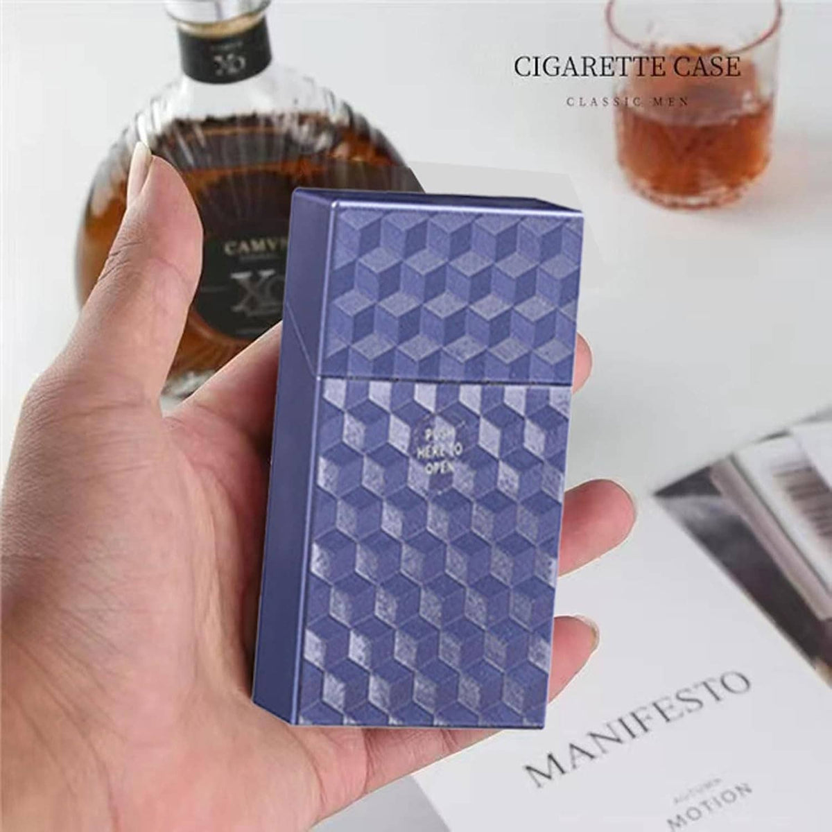 Blue cube-textured king-size cigarette case held in hand, push-to-open front