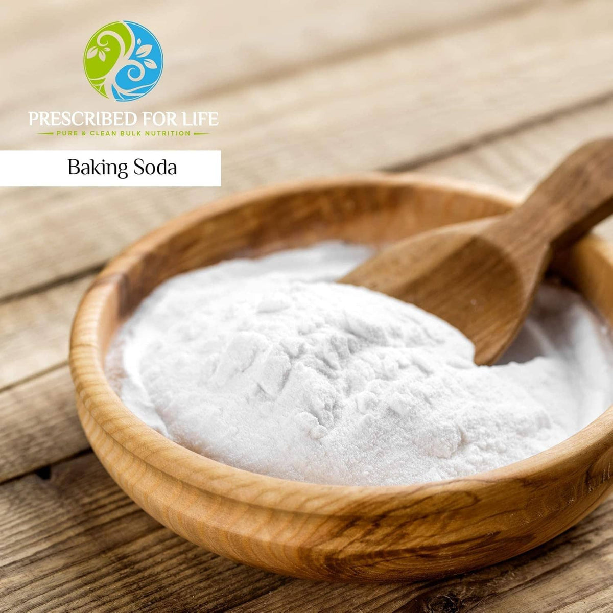 Wooden bowl filled with white baking soda powder