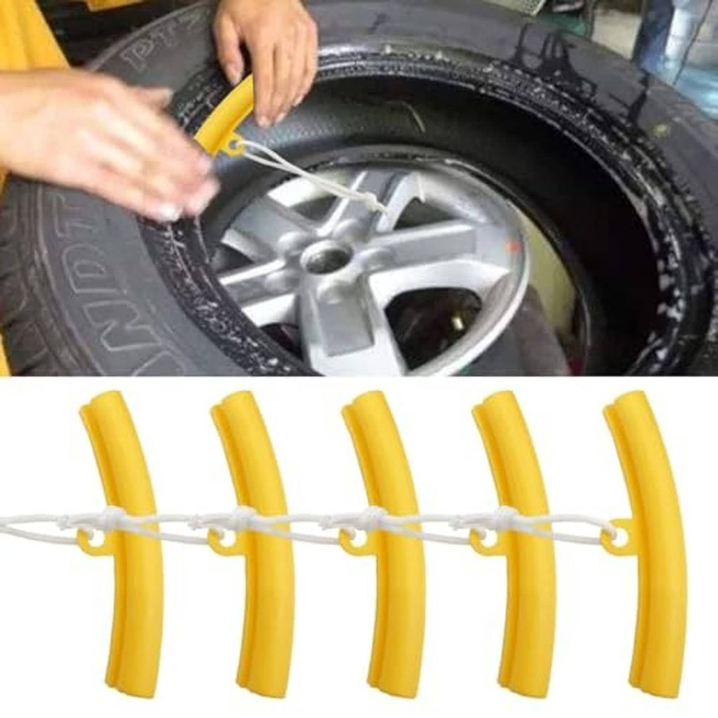 Yellow set of tire changer rim protectors edge savers with white cords