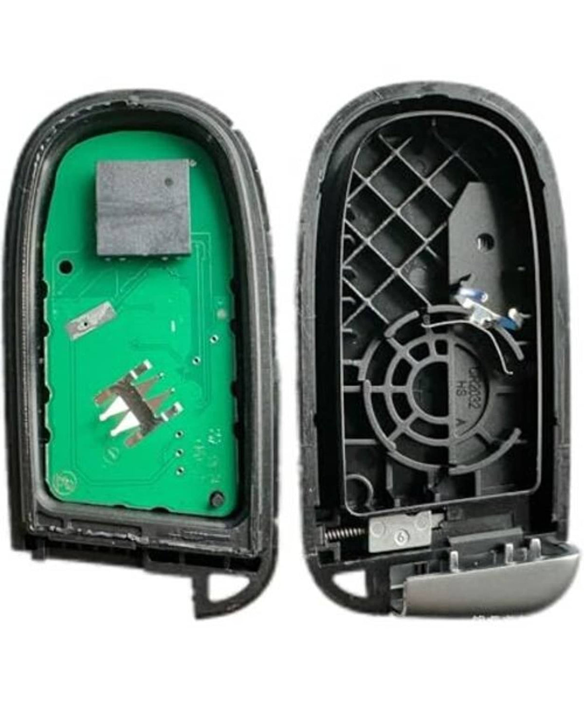 Open key fob case with green circuit board and visible interior parts