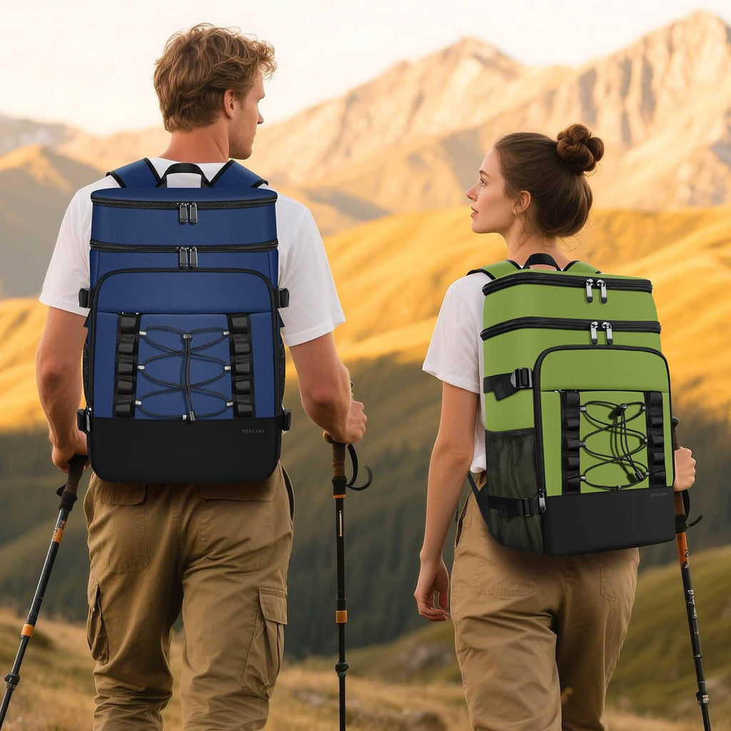 Dark blue insulated cooler backpack worn on back with padded shoulder straps