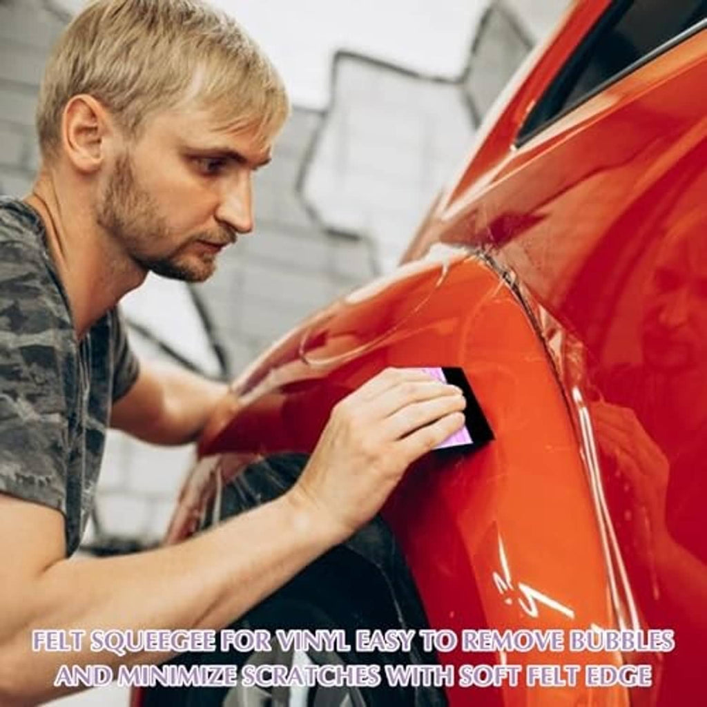 Purple felt vinyl squeegee with black edge used on car wrap, held in hand