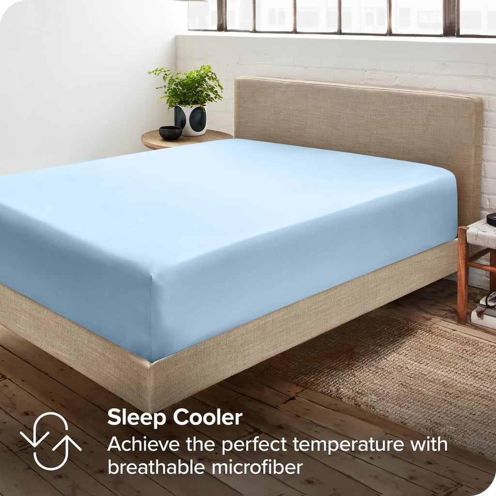Light blue fitted sheet on bed with smooth, even surface